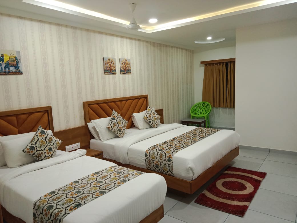 Twin room with decorative wallpaper